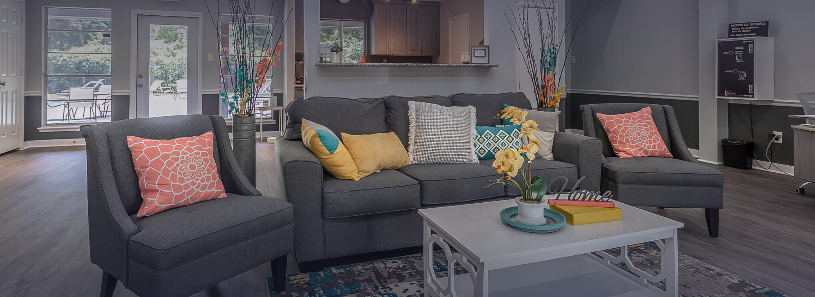 gray couch set with decorative pillows in the clubhouse